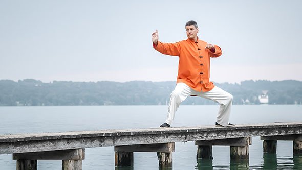 Qi Gong practised outdoors on a jetty