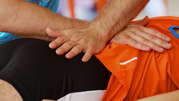 Sports massage being applied to a leg